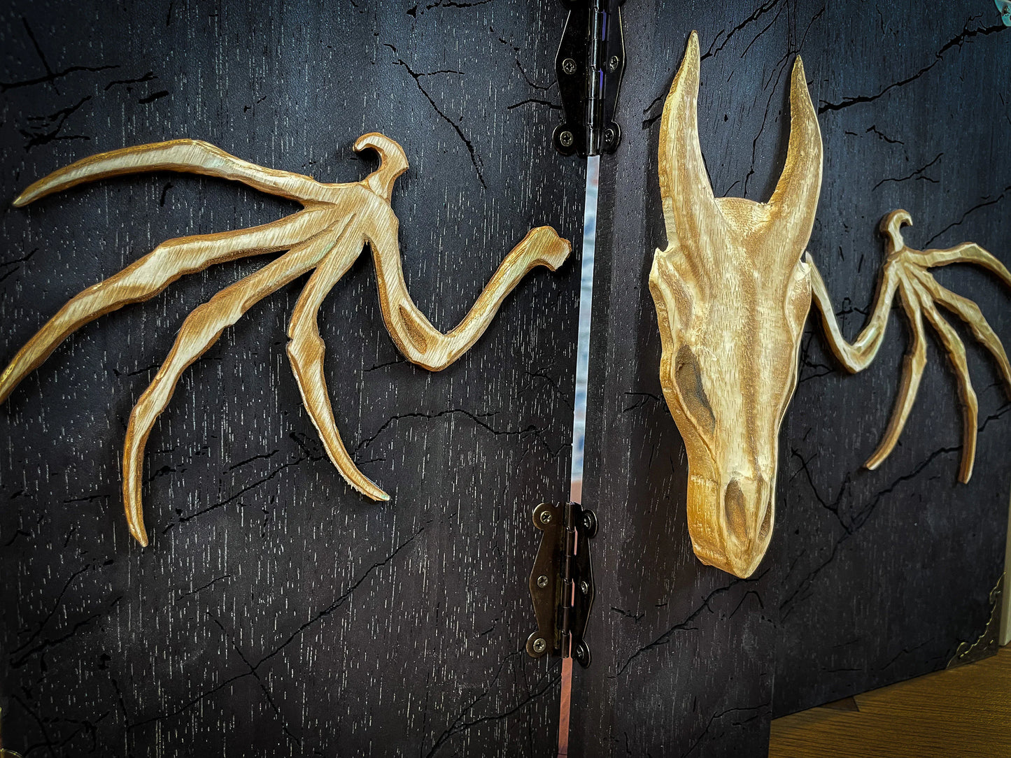 Dragon's Wrath Dungeon Master Screen. Made from solid wood and made to fold to resemble a book when not in use, this screen is stylish, fun and adds atmosphere to any game. Comprising 4 solid wood panels connected using antiqued metal hinges; they fold together to resemble a book when closed. Free UK delivery from Fandomonium