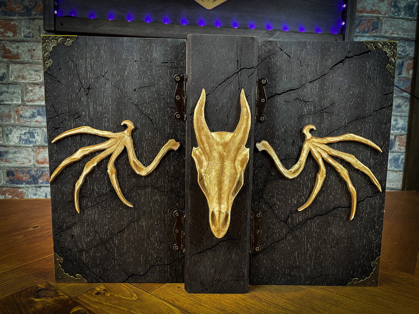 Dragon's Wrath Dungeon Master Screen. Made from solid wood and made to fold to resemble a book when not in use, this screen is stylish, fun and adds atmosphere to any game. Comprising 4 solid wood panels connected using antiqued metal hinges; they fold together to resemble a book when closed. Free UK delivery from Fandomonium