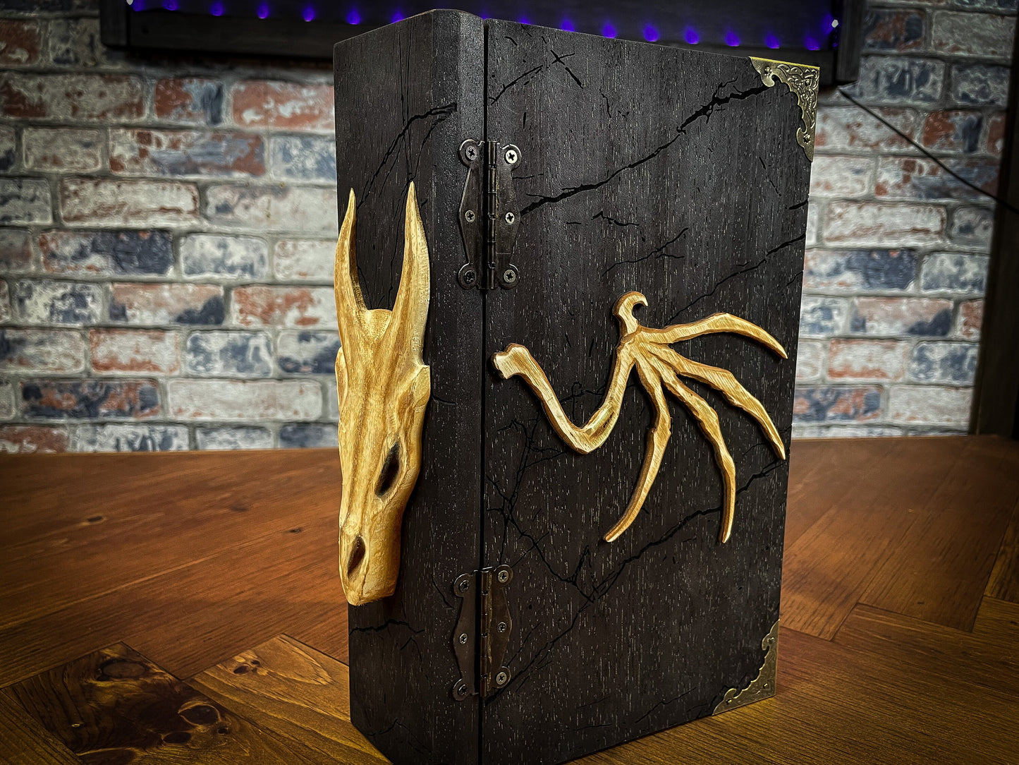 Dragon's Wrath Dungeon Master Screen. Made from solid wood and made to fold to resemble a book when not in use, this screen is stylish, fun and adds atmosphere to any game. Comprising 4 solid wood panels connected using antiqued metal hinges; they fold together to resemble a book when closed. Free UK delivery from Fandomonium