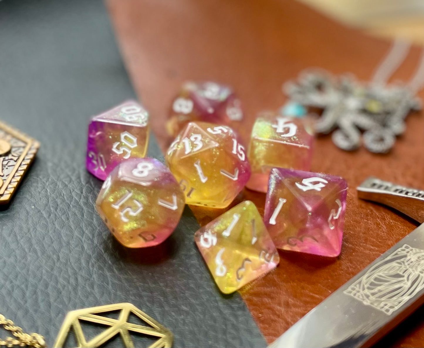 Chaos Fairy Polyhedral Dice Set Roll to the gods with these pink and gold shimmer resin polyhedral dice set. They are standard 16mm polyhedral dice sets perfect for Tabletop games and RPG's such as pathfinder or dungeons and dragons. This set includes one of each D20, D12, D10, D%, D8, D6, D4.