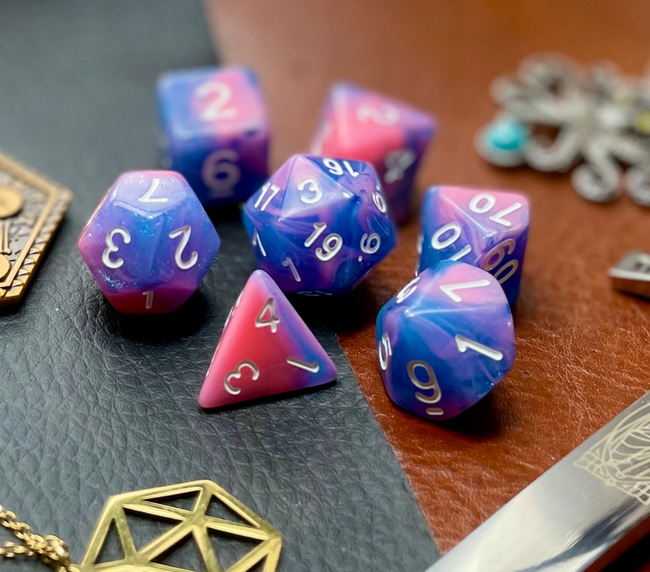 Miami Vice Polyhedral Dice Set  Miami Vice... or should that be dice? These vivid blue and pink swirl resin polyhedral dice sets are a perfect addition to any dice collection.  They are standard 16mm polyhedral dice sets perfect for Tabletop games and RPG's such as pathfinder or dungeons and dragons.  This set includes one of each D20, D12, D10, D%, D8, D6, D4.