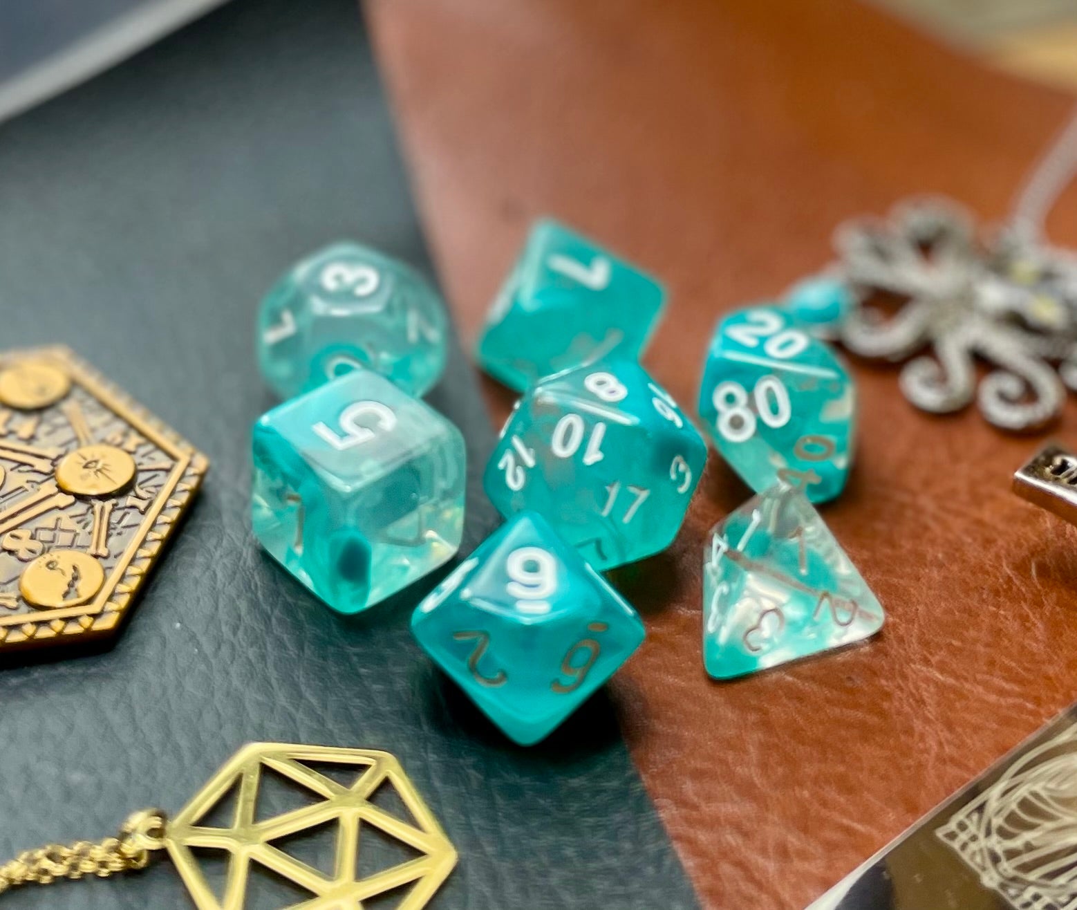Teal Lake Polyhedral Dice Set  Peer into the lake on tranquility with these translucent teal and clear swirl resin polyhedral dice sets are a perfect addition to any dice collection.  They are standard 16mm polyhedral dice sets perfect for Tabletop games and RPG's such as pathfinder or dungeons and dragons.  This set includes one of each D20, D12, D10, D%, D8, D6, D4.