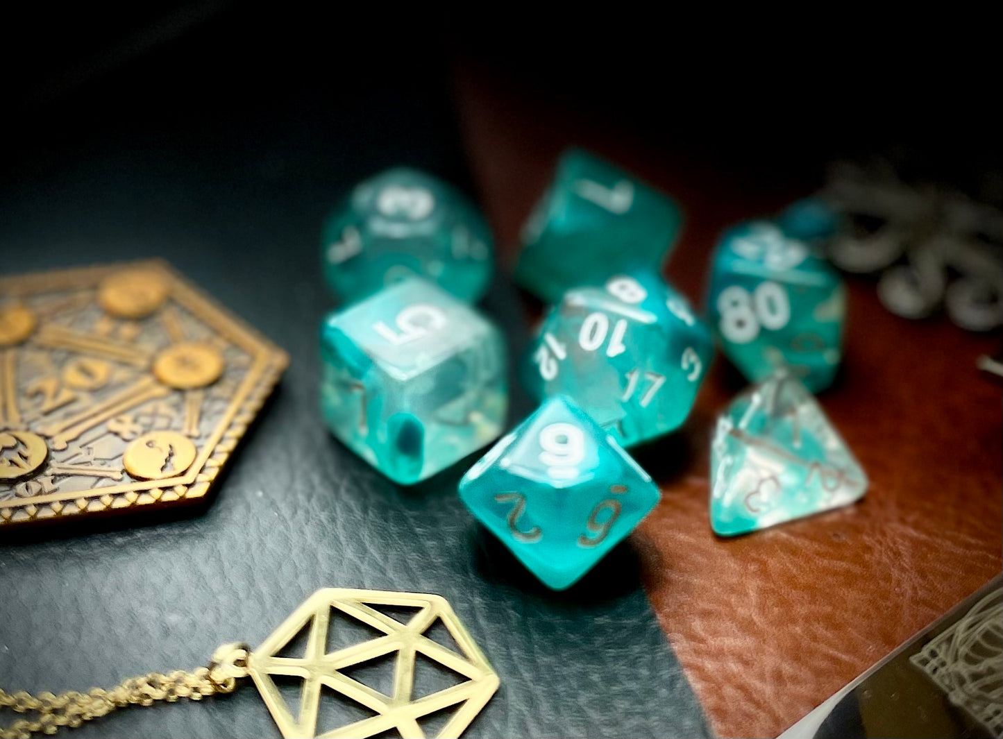 Teal Lake Polyhedral Dice Set Peer into the lake on tranquility with these translucent teal and clear swirl resin polyhedral dice sets are a perfect addition to any dice collection. They are standard 16mm polyhedral dice sets perfect for Tabletop games and RPG's such as pathfinder or dungeons and dragons. This set includes one of each D20, D12, D10, D%, D8, D6, D4.