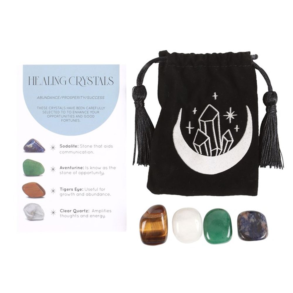 Success Healing Crystal Set with Moon Trinket Dish This stunning set of healing crystals comes with four crystal tumblestones to help attract prosperity and success. Includes a crescent moon trinket dish, matching information card and a printed drawstring, making this a meaningful gift for those in need of some extra care. Stones include; sodalite, aventurine, tiger's eye and clear quartz. Free UK delivery by Fandomonium