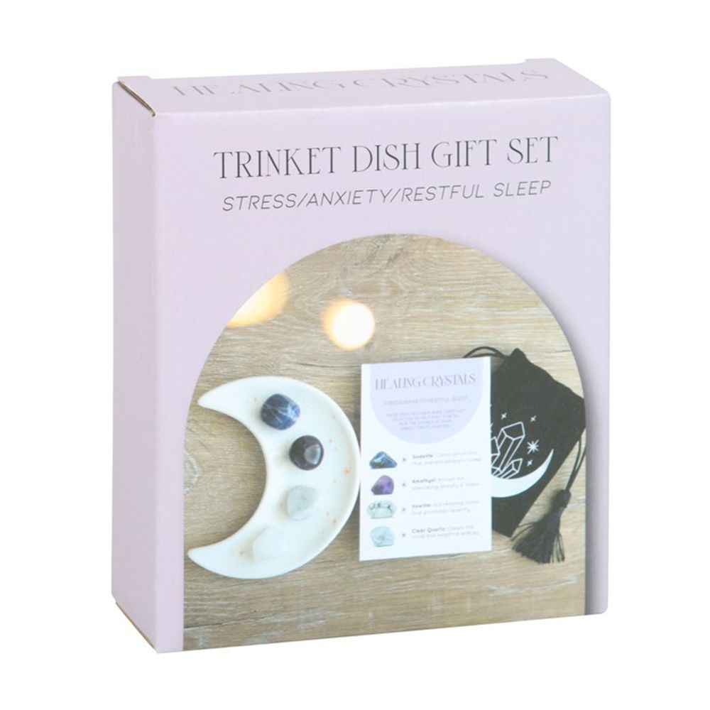Stress Healing Crystal Set with Moon Trinket Dish This stunning set of healing crystals comes with four crystal tumblestones to help reduce stress, ease anxiety and promote restful sleep. Includes a crescent moon trinket dish, matching information card and a printed drawstring, making this a meaningful gift for those in need of some extra care. Stones include; sodalite, amethyst, howlite and clear quartz. Free UK delivery by Fandomonium