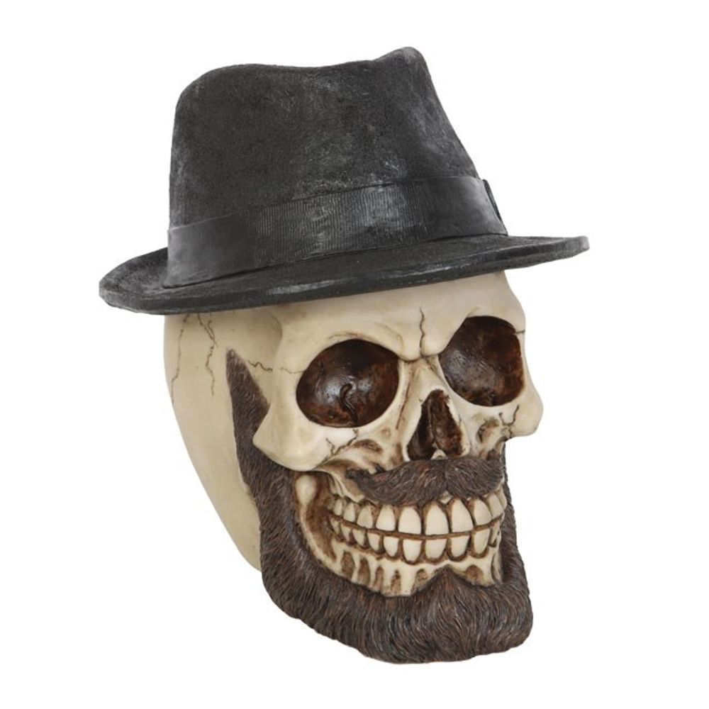 Skull Ornament with Trilby Hat This realistic resin skull ornament wears a classic trilby hat accented by an impressive beard and moustache. Highly detailed with hand painted details, this eye-catching figurine will be a welcome addition to any gothic skull collection. Free UK delivery by Fandomonium
