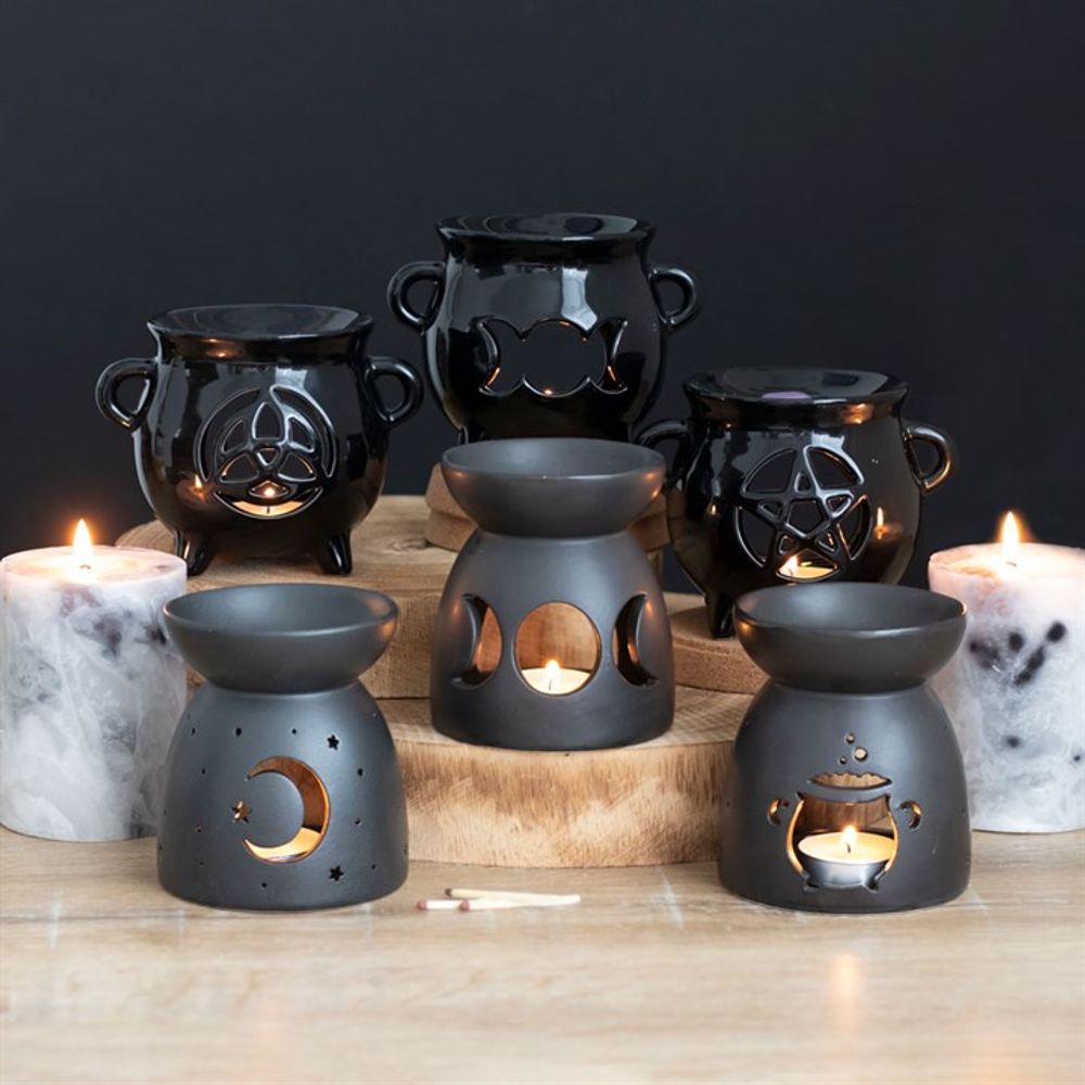 Triple Moon Cauldron Oil Burner Glossy black cauldron-shaped ceramic oil burner with a triple moon cut-out design. A fantastic gift for any of your coven. Free UK delivery by Fandomonium