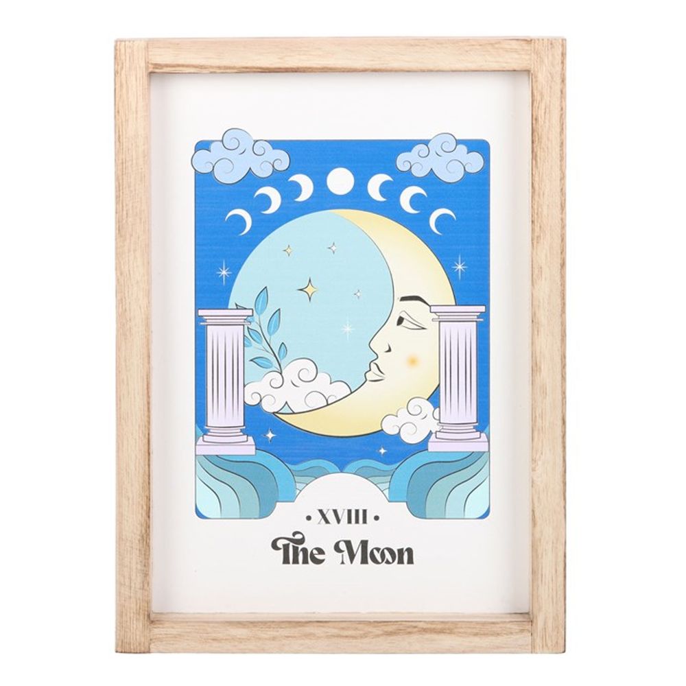 The Moon Celestial Framed Wall Print This framed art print showcasing 'The Moon' brings a touch of celestial magic to any trendsetter's space, blending mystical vibes with a calming color palette. The serene illustration invites calm, ideal for creating a tranquil corner in the home a bustling young adult's life. Free delivery with Fandomonium