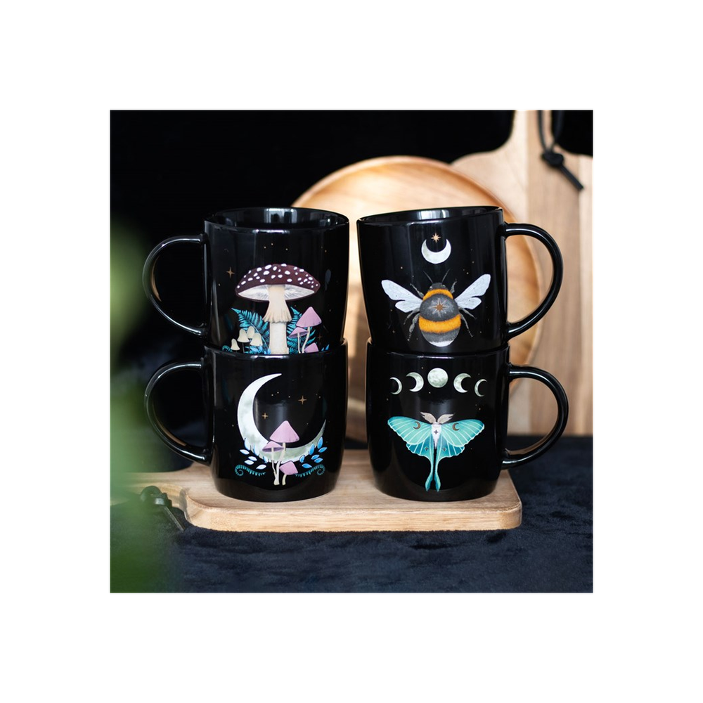 Set of 4 Dark Forest Mugs This set of four mugs is perfect for anyone who wants to fill their home with practical yet distinctive pieces which bring joy when used. Featuring a different design including a luna moth, toadstools and a bee, each design is accented with moon and star details adding a touch of celestial wonder. Presented in a matching box, this set of mugs makes a perfect gift. Free UK delivery from Fandomonium