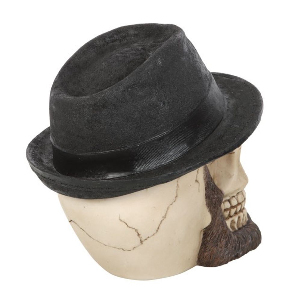 Skull Ornament with Trilby Hat This realistic resin skull ornament wears a classic trilby hat accented by an impressive beard and moustache. Highly detailed with hand painted details, this eye-catching figurine will be a welcome addition to any gothic skull collection. Free UK delivery by Fandomonium