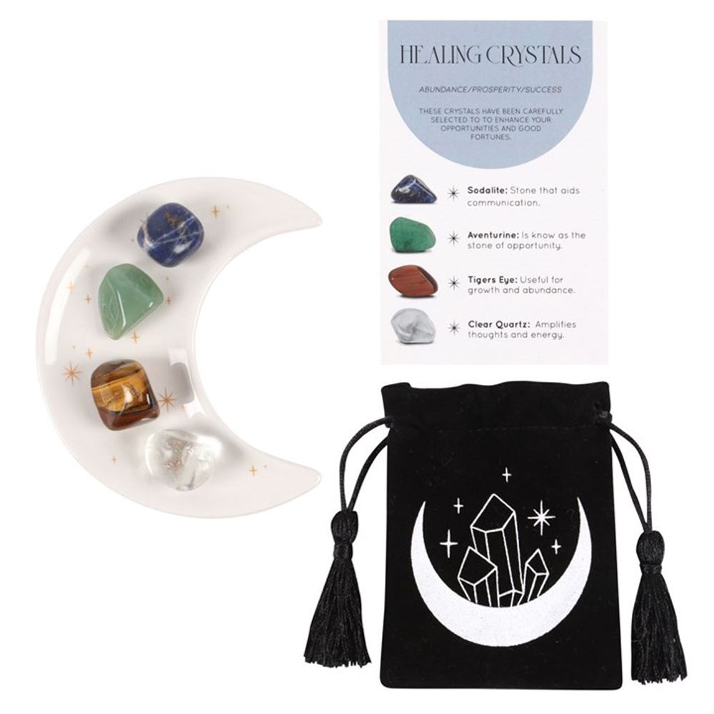 Success Healing Crystal Set with Moon Trinket Dish This stunning set of healing crystals comes with four crystal tumblestones to help attract prosperity and success. Includes a crescent moon trinket dish, matching information card and a printed drawstring, making this a meaningful gift for those in need of some extra care. Stones include; sodalite, aventurine, tiger's eye and clear quartz. Free UK delivery by Fandomonium