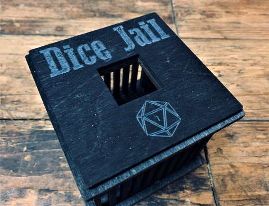 black wooden dice jail with colourful text. Choice of 3 colours. For use with Dungeons and Dragons, D&D, Tabletop Gaming. Dice games and RPG's. Free UK delivery with Fandomonium