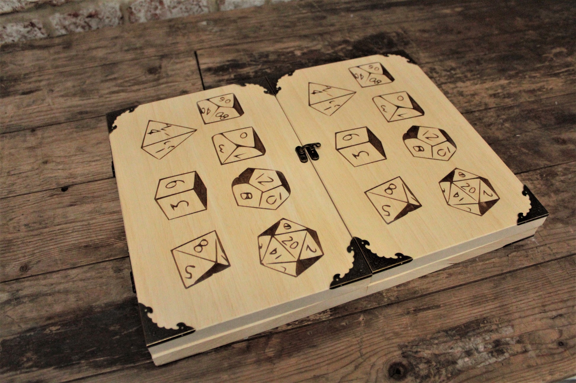 Wooden Dice Design Dungeon Master Screen -  Handmade By FandomoniumAn impressive, budget friendly addition to your RPG setup. Featuring Fandomonium's Dice design, the screen's 3 sections fold on hinges and has an antique effect catch for easy storage. The finish is aged and antiqued by hand to give you that rustic, tavern feel. Hand made by Fandomonium