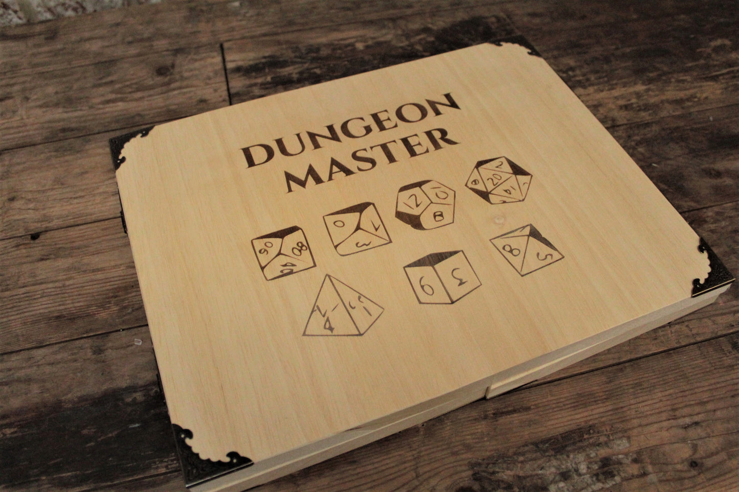 Wooden Dice Design Dungeon Master Screen - Handmade By FandomoniumAn impressive, budget friendly addition to your RPG setup. Featuring Fandomonium's Dice design, the screen's 3 sections fold on hinges and has an antique effect catch for easy storage. The finish is aged and antiqued by hand to give you that rustic, tavern feel. Hand made by Fandomonium