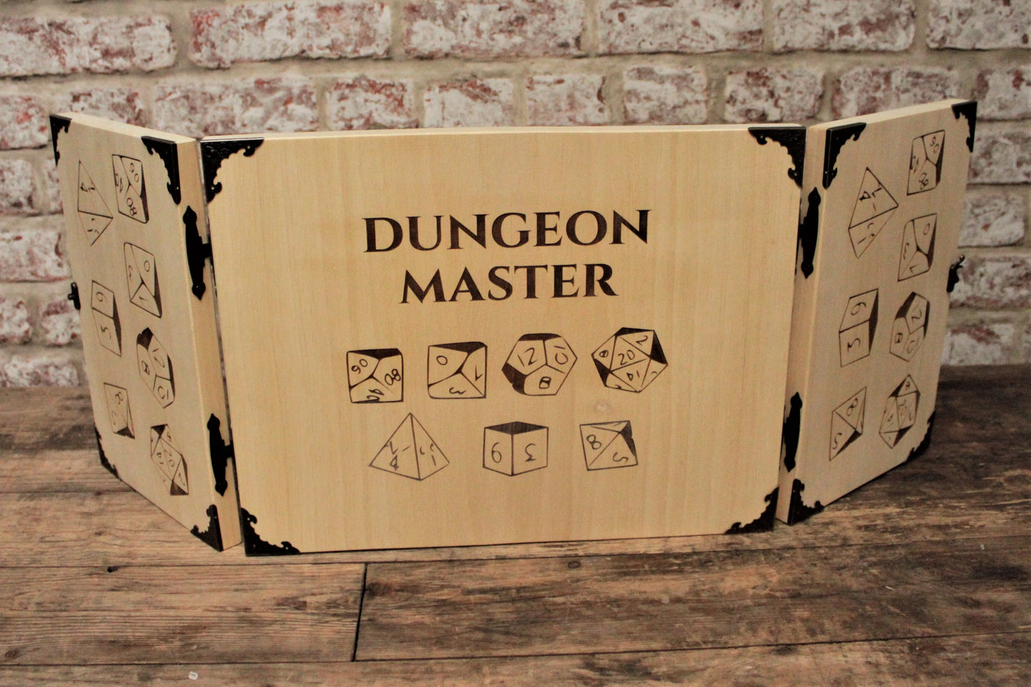 Wooden Dice Design Dungeon Master Screen - Handmade By FandomoniumAn impressive, budget friendly addition to your RPG setup. Featuring Fandomonium's Dice design, the screen's 3 sections fold on hinges and has an antique effect catch for easy storage. The finish is aged and antiqued by hand to give you that rustic, tavern feel. Hand made by Fandomonium