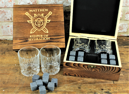 ersonalised Tabletop Gaming Design Whiskey Set. This unique and fun sets contains a set of 6 whiskey stones engraved to look like dice and a cut glass tumbler - all in a solid wood engraved gift box.
