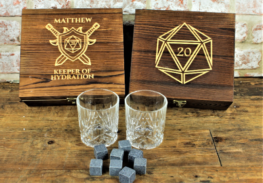 ersonalised Tabletop Gaming Design Whiskey Set. This unique and fun sets contains a set of 6 whiskey stones engraved to look like dice and a cut glass tumbler - all in a solid wood engraved gift box.