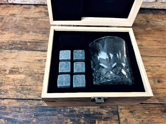 ersonalised Tabletop Gaming Design Whiskey Set. This unique and fun sets contains a set of 6 whiskey stones engraved to look like dice and a cut glass tumbler - all in a solid wood engraved gift box.
