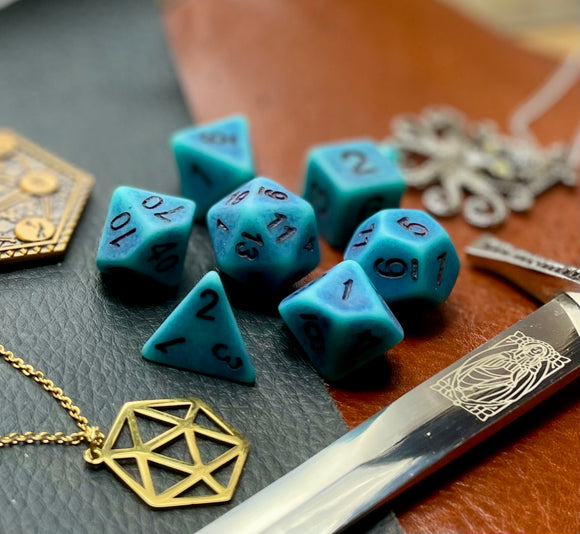 Ancient blue stone effect resin polyhedral dice set.  Yet another reason to add to your growing dice collection with these fantastic resin dice.  They are standard 16mm polyhedral dice sets perfect for Tabletop games and RPG's such as pathfinder or dungeons and dragons.  This set includes one of each D20, D12, D10, D%, D8, D6, D4.