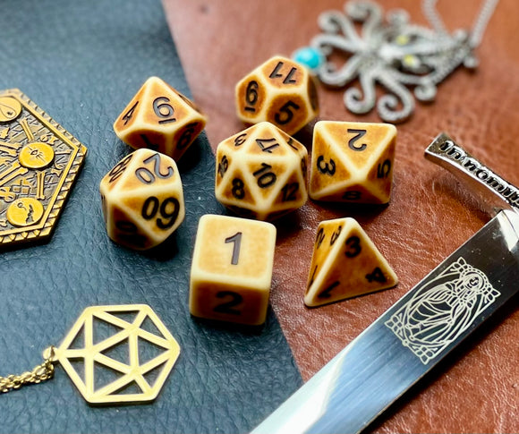 Ancient bone effect resin polyhedral dice set.  Yet another reason to add to your growing dice collection with these fantastic resin dice.  They are standard 16mm polyhedral dice sets perfect for Tabletop games and RPG's such as pathfinder or dungeons and dragons.  This set includes one of each D20, D12, D10, D%, D8, D6, D4.