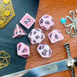 Ancient pink stone effect resin polyhedral dice set.  Yet another reason to add to your growing dice collection with these fantastic resin dice.  They are standard 16mm polyhedral dice sets perfect for Tabletop games and RPG's such as pathfinder or dungeons and dragons.  This set includes one of each D20, D12, D10, D%, D8, D6, D4.