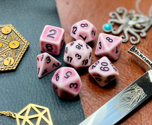 Ancient pink stone effect resin polyhedral dice set.  Yet another reason to add to your growing dice collection with these fantastic resin dice.  They are standard 16mm polyhedral dice sets perfect for Tabletop games and RPG's such as pathfinder or dungeons and dragons.  This set includes one of each D20, D12, D10, D%, D8, D6, D4.