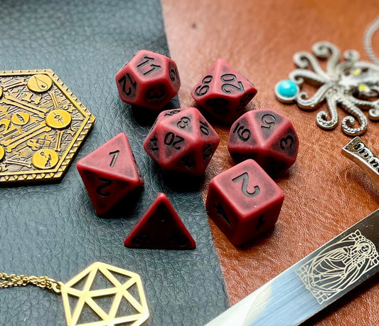 Ancient red stone effect resin polyhedral dice set.  Yet another reason to add to your growing dice collection with these fantastic resin dice.  They are standard 16mm polyhedral dice sets perfect for Tabletop games and RPG's such as pathfinder or dungeons and dragons.  This set includes one of each D20, D12, D10, D%, D8, D6, D4.