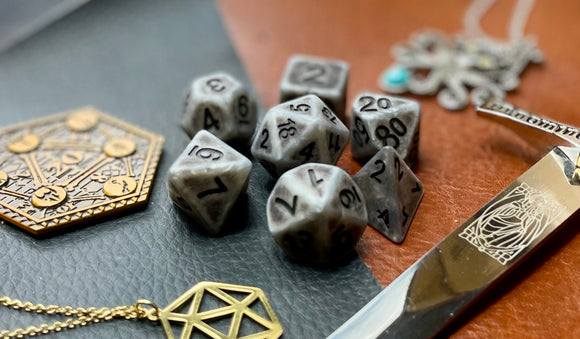 Ancient silver effect resin polyhedral dice set.  Yet another reason to add to your growing dice collection with these fantastic resin dice.  They are standard 16mm polyhedral dice sets perfect for Tabletop games and RPG's such as pathfinder or dungeons and dragons.  This set includes one of each D20, D12, D10, D%, D8, D6, D4.