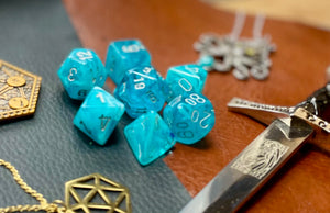 Aqua Cirrus Chessex Dice Set  These genuine Chessex polyhedral dice sets are a perfect addition to any dice collection.  They are standard 16mm polyhedral dice sets perfect for Tabletop games and RPG's such as pathfinder or dungeons and dragons.  This set includes one of each D20, D12, D10, D%, D8, D6, D4.  Why Choose Chessex?  Chessex are the market leaders in quality of dice and consistency of roll and have been creating dice for over 30 years