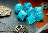 Aqua Cirrus Chessex Dice Set  These genuine Chessex polyhedral dice sets are a perfect addition to any dice collection.  They are standard 16mm polyhedral dice sets perfect for Tabletop games and RPG's such as pathfinder or dungeons and dragons.  This set includes one of each D20, D12, D10, D%, D8, D6, D4.  Why Choose Chessex?  Chessex are the market leaders in quality of dice and consistency of roll and have been creating dice for over 30 years