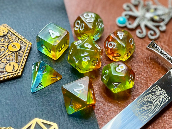 Aurora Autumn resin polyhedral dice set.  Yet another reason to add to your growing dice collection with these fantastic resin dice. These are beautiful translucent dice featuring a full range of autumnal yellows, golds and oranges.   They are standard 16mm polyhedral dice sets perfect for Tabletop games and RPG's such as pathfinder or dungeons and dragons.  This set includes one of each D20, D12, D10, D%, D8, D6, D4.