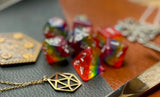 Aurora Sunset resin polyhedral dice set.  Yet another reason to add to your growing dice collection with these fantastic resin dice. These are beautiful translucent dice featuring a full rainbow of colours.   They are standard 16mm polyhedral dice sets perfect for Tabletop games and RPG's such as pathfinder or dungeons and dragons.  This set includes one of each D20, D12, D10, D%, D8, D6, D4.