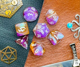 Amethyst Sunset Polyhedral Dice Set  Enter the Fey Wilds with these blue, pink, black and white marbled resin polyhedral dice set.  They are standard 16mm polyhedral dice sets perfect for Tabletop games and RPG's such as pathfinder or dungeons and dragons.  This set includes one of each D20, D12, D10, D%, D8, D6, D4.