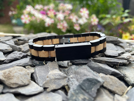 Black Walnut & Zebrano Bracelet

Made from solid walnut and "Zebra Wood" Zebrano; these bracelets are both comfortable to wear and a unique piece of jewellery.