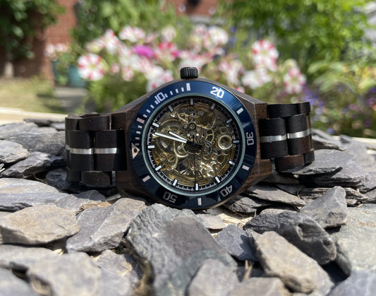 Black Wood & Blue Cog Style Interlocking Strap Self Winding Wooden Eco Watch

Made from solid wood with silver and blue anodised stainless steel; these watches are both comfortable to wear and a unique timepiece.