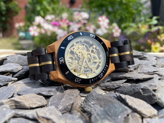 Black Wood & Gold Cog Style Interlocking Strap Self Winding Wooden Eco Watch

Made from solid wood and gold anodised stainless steel; these watches are both comfortable to wear and a unique timepiece.