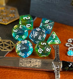 Elemental agean sea resin polyhedral dice set.  Delve into the Mediterranean waters with these fantastic resin dice. Combining translucent green and blues; each dice has its own unique pattern.