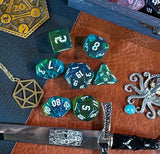 Elemental agean sea resin polyhedral dice set.  Delve into the Mediterranean waters with these fantastic resin dice. Combining translucent green and blues; each dice has its own unique pattern.