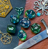 Elemental agean sea resin polyhedral dice set.  Delve into the Mediterranean waters with these fantastic resin dice. Combining translucent green and blues; each dice has its own unique pattern.