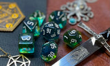 Elemental agean sea resin polyhedral dice set.  Delve into the Mediterranean waters with these fantastic resin dice. Combining translucent green and blues; each dice has its own unique pattern.