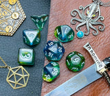 Elemental agean sea resin polyhedral dice set.  Delve into the Mediterranean waters with these fantastic resin dice. Combining translucent green and blues; each dice has its own unique pattern.