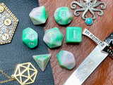 Elemental chaos green and white resin polyhedral dice set.  Unleash the fury of the earth elemental spirits with these fantastic resin dice. Combining green and white swirls; each dice has its own unique pattern.