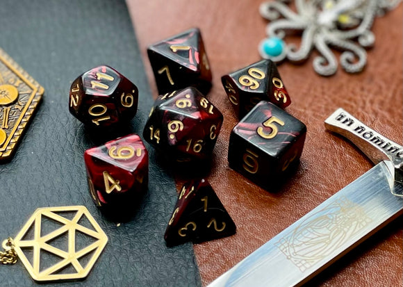 Elemental dark red and black resin polyhedral dice set.  Harness the power of the fire elemental spirits with these fantastic resin dice. Combining dark red and black swirls, each dice has its own unique pattern.  They are standard 16mm polyhedral dice sets perfect for Tabletop games and RPG's such as pathfinder or dungeons and dragons.  This set includes one of each D20, D12, D10, D%, D8, D6, D4.