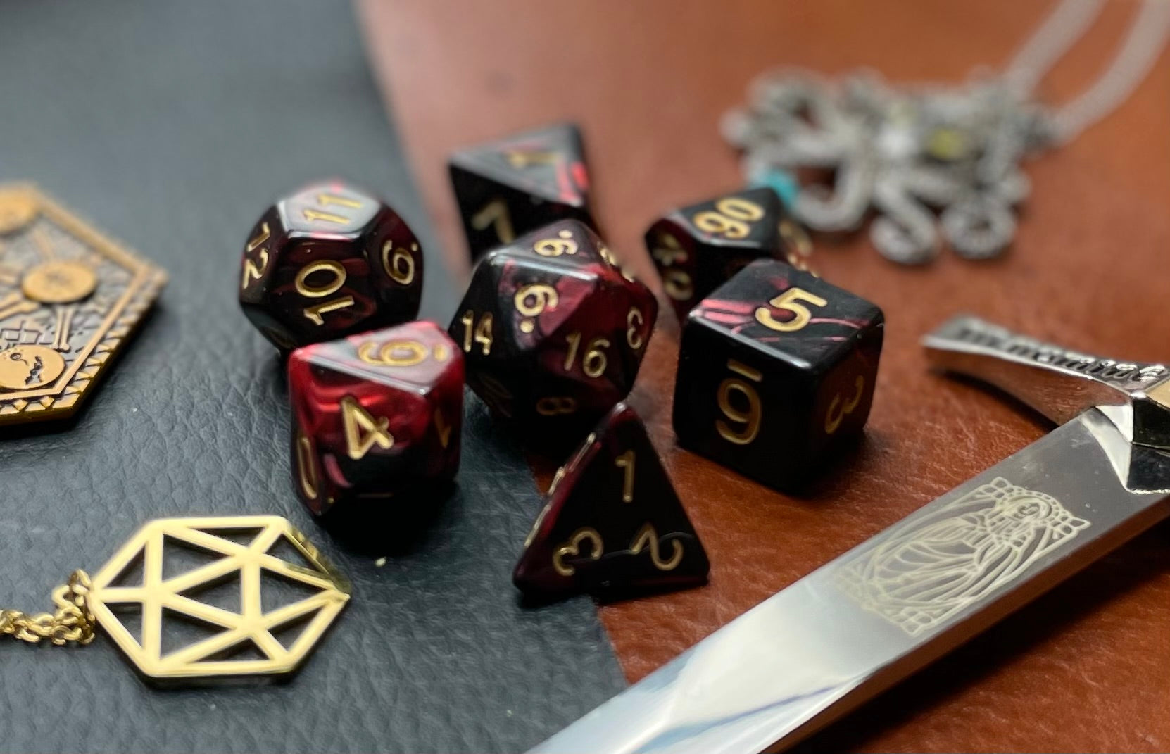 Elemental dark red and black resin polyhedral dice set.  Harness the power of the fire elemental spirits with these fantastic resin dice. Combining dark red and black swirls, each dice has its own unique pattern.  They are standard 16mm polyhedral dice sets perfect for Tabletop games and RPG's such as pathfinder or dungeons and dragons.  This set includes one of each D20, D12, D10, D%, D8, D6, D4.