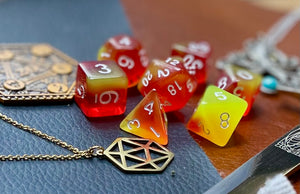 Elemental firestorm resin polyhedral dice set.  Unleash the fury of the fire elemental spirits with these fantastic resin dice. Combining vivid red and yellow swirls; each dice has its own unique pattern.