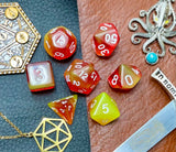 Elemental firestorm resin polyhedral dice set.  Unleash the fury of the fire elemental spirits with these fantastic resin dice. Combining vivid red and yellow swirls; each dice has its own unique pattern.