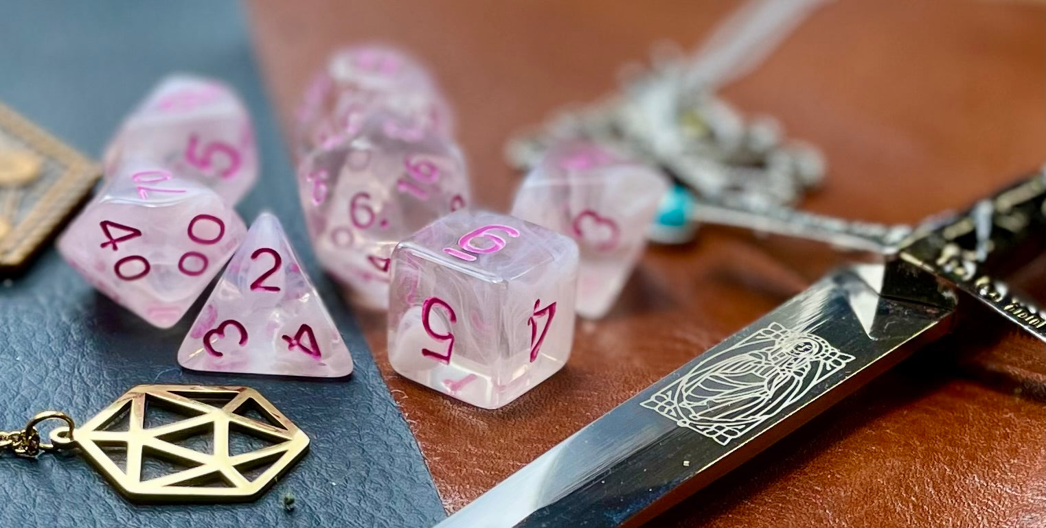 Elemental Gem Cloudy Passion Polyhedral Dice Set  Awaken the elements with these fantastic resin dice. Combining flawless crystal clear resin with white swirls; each dice has its own unique pattern.  They are standard 16mm polyhedral dice sets perfect for Tabletop games and RPG's such as pathfinder or dungeons and dragons.  This set includes one of each D20, D12, D10, D%, D8, D6, D4.