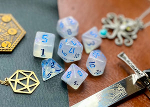 Elemental Gem Frozen Heart Polyhedral Dice Set  Awaken the elements with these fantastic resin dice. Combining flawless crystal clear resin with white swirls; each dice has its own unique pattern.  They are standard 16mm polyhedral dice sets perfect for Tabletop games and RPG's such as pathfinder or dungeons and dragons.  This set includes one of each D20, D12, D10, D%, D8, D6, D4.