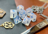 Elemental Gem Frozen Heart Polyhedral Dice Set  Awaken the elements with these fantastic resin dice. Combining flawless crystal clear resin with white swirls; each dice has its own unique pattern.  They are standard 16mm polyhedral dice sets perfect for Tabletop games and RPG's such as pathfinder or dungeons and dragons.  This set includes one of each D20, D12, D10, D%, D8, D6, D4.