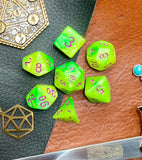 Elemental Yellow and Green resin polyhedral dice set.  Awaken the elements with these fantastic resin dice. Combining vibrant yellow and green swirls; each dice has its own unique pattern.  They are standard 16mm polyhedral dice sets perfect for Tabletop games and RPG's such as pathfinder or dungeons and dragons.  This set includes one of each D20, D12, D10, D%, D8, D6, D4.